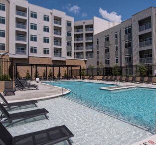 Outdoor swimming pool with shallow water seating